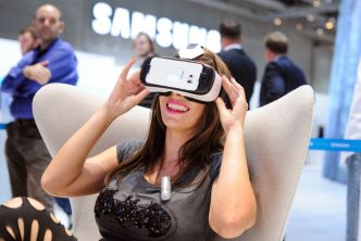 Qantas Airlines. “Qantas first-class passengers experience virtual reality, via Samsung's Gear VR headset.” Photograph. Bloomberg. June 19, 2015